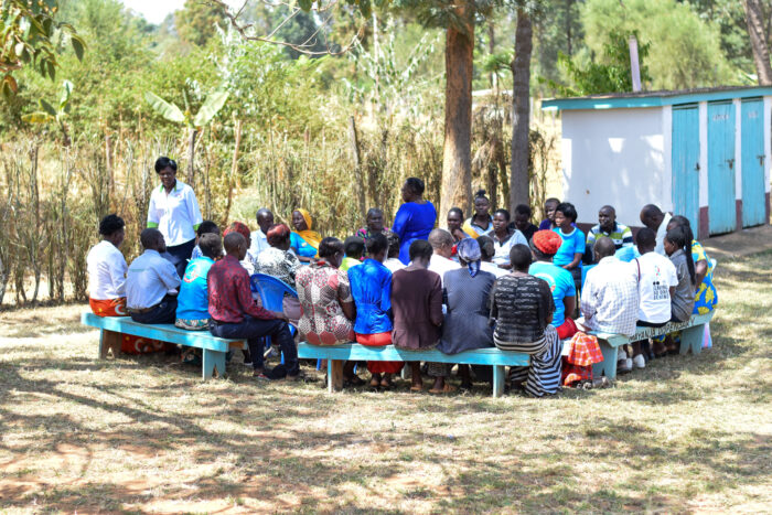 Community members gathered in a discussion outside